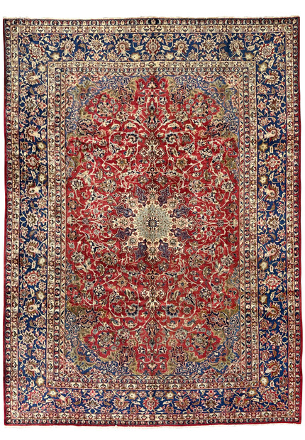 Full view of the 9'9 x 14'5 vintage Najafabad Persian rug featuring a large medallion, ruby red field, and navy floral borders.