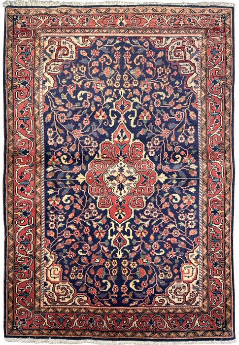 Full view of a 3x5 Vintage Persian Sarough Rug laid out, displaying the rich navy blue field and elaborate border designs
