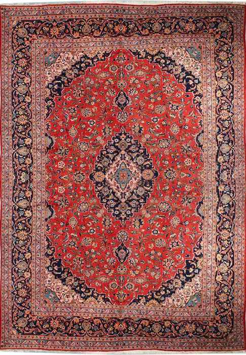 A front-facing image of a Persian Kashan rug laid flat, showing the entire pattern with a vibrant red field, central medallion, and intricate floral and geometric patterns in shades of blue, cream, and orange.