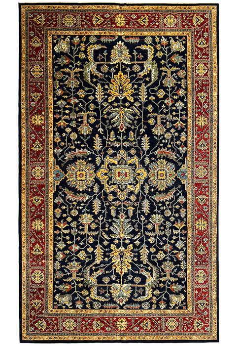 Close-up of a 10x16'4 handmade Ziegler rug showing intricate navy blue background with floral and geometric patterns in gold, green, light blue, and red.