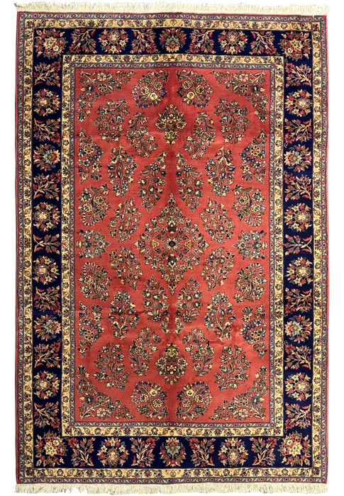 6'9 x 9'8 Persian Yazd rug with rich red field and intricate floral designs.