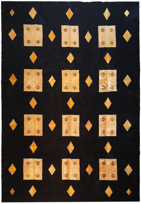 Full view of 8'9 x 11'10 contemporary wool and silk rug with geometric designs.