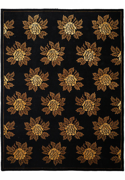 Full view of black modern handmade rug with golden floral design and 3D effect