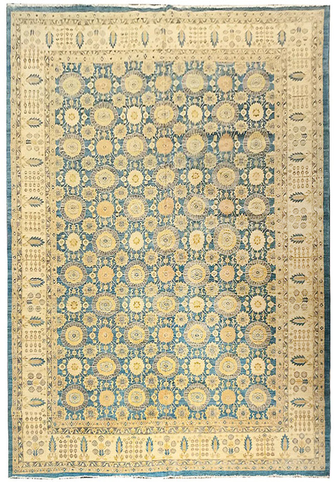 Full view of an 11'7 x 16'5 light blue Oriental Chobi Peshawar rug with repeating floral medallions, beige and cream details, and a wide decorative border
