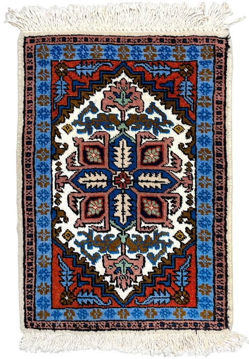 Full overhead view of 1'3 x 2 Persian Ardebil rug, stepped geometric medallion on ivory with rust and sky blue