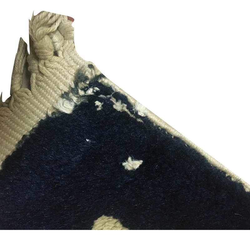 Corner detail of the semi-antique runner rug, showing the fine weave and color transitions.