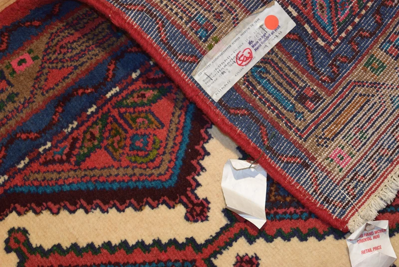 Side view of the 2'5 x 9 Persian Hamedan Runner Rug, illustrating its length and the beautiful, intricate patterns that run throughout the rug. This view captures the elegance and traditional artistry of Persian rug-making
