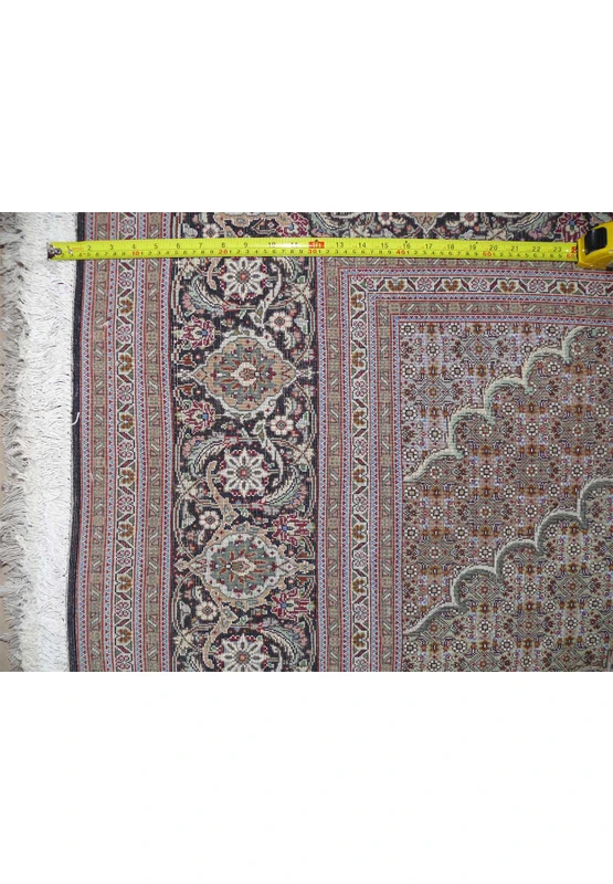 Back of the Persian Tabriz Mahi Rug with a ruler showing the high knot density for quality assurance