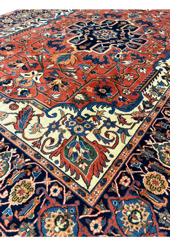 Close up of fine wool knotting and crisp geometric detailing in a high quality Persian Heriz rug