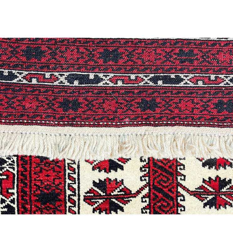 The back of the Persian Baluch rug, showcasing the high-quality craftsmanship and attention to detail