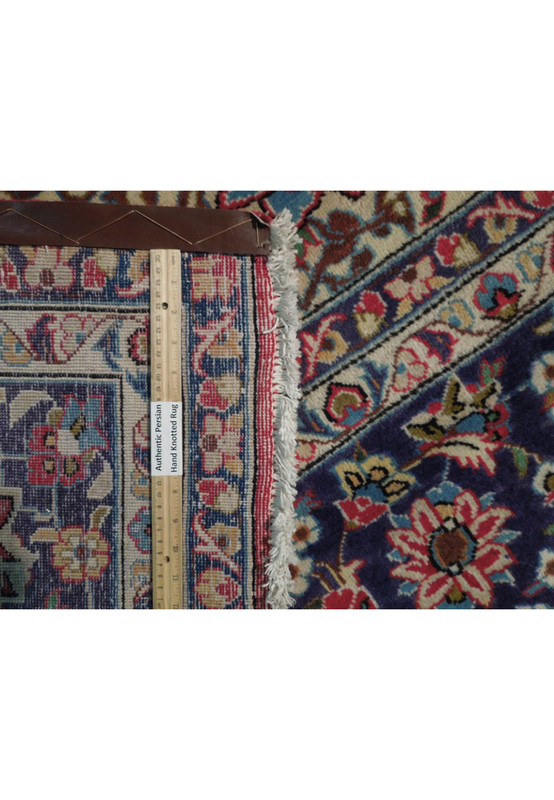 A beautiful room showcasing the grandeur of a 10x16 Persian Najafabad rug, enhancing the décor with its timeless beauty."