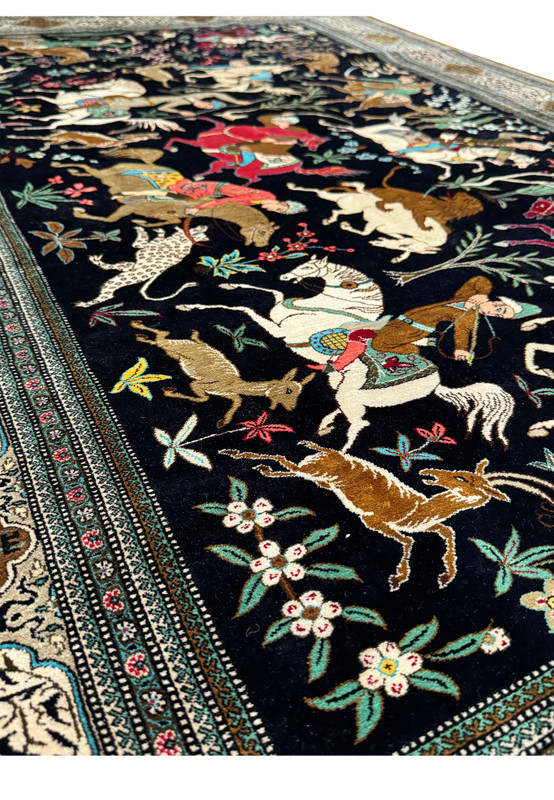 Longitudinal view of Persian Qum Silk Hunting Rug showing the full flow of the hunting scene and parallel border design