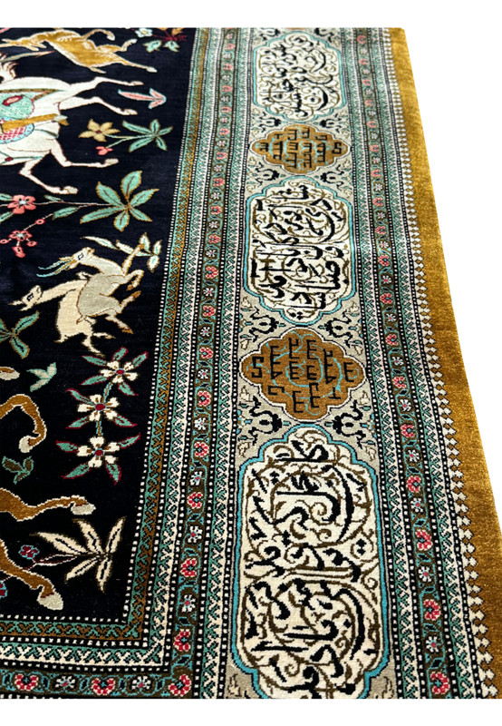 Corner detail of Persian Qum Silk Hunting Rug highlighting the transition from intricate border to the central hunting scene.
