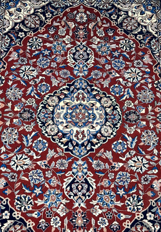 Detailed view of 4x6 Persian Isfahan rug showcasing intricate floral patterns and central medallion