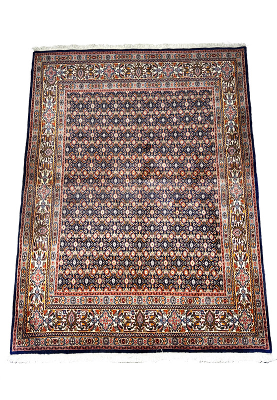 view of a 5x7 Persian Moud Rug displaying its intricate floral patterns and navy blue field.