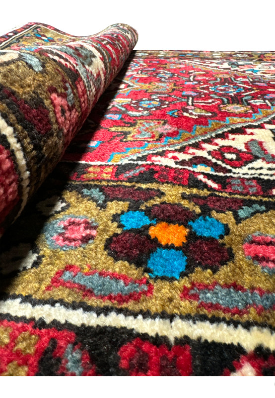 Elevated view of the Persian Hamedan rug showing the textural depth and detailed motifs