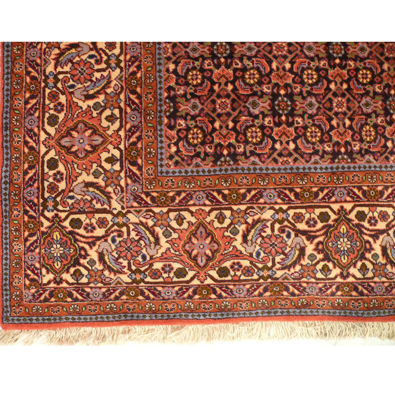 Elaborate border design of a Persian Bijar Rug with multiple layers of floral motifs.