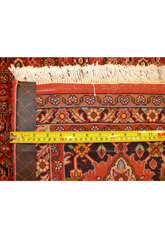 Close-up of the Persian Bijar Rug's edge, showing the precision of the pattern and quality of the weave.