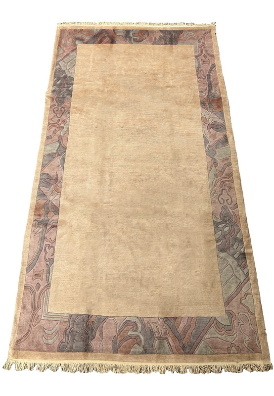Full-length view of a 6'6 x 12'8 Modern Royal Tibetan beige rug showcasing the border and fringe details