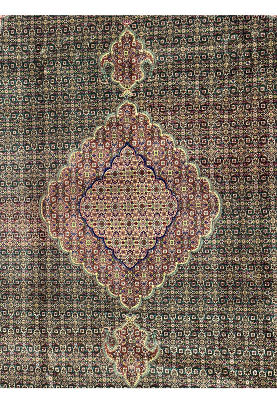 Close-up of the delicate silk and wool blend in a Persian Tabriz Mahi rug