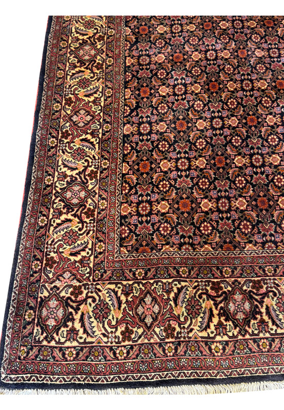 Corner detail of the Bijar Rug, where the border meets the all-over interior design