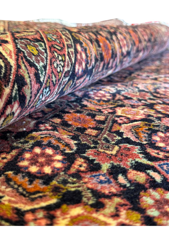 Folded section of the Bijar Rug, providing a sense of the rug's thickness and weave density