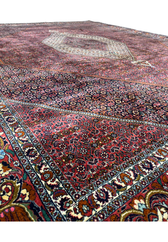 Macro view of the rug's pile and weave, showcasing the intricate design and the plush quality of the wool