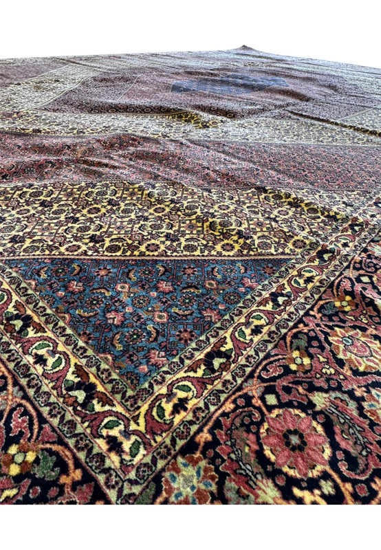 An impressive 12x17 Bijar Persian rug with an eye-catching central medallion, rich in traditional symbolism and intricate details, making it a testament to the enduring craftsmanship of the region