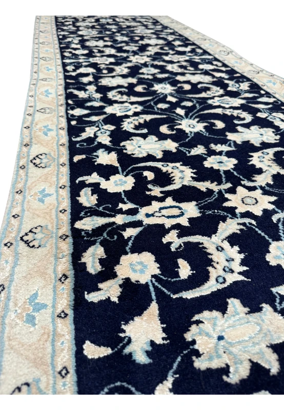 Perspective view of the Persian Nain Runner, giving a sense of the rug's texture and weave quality.