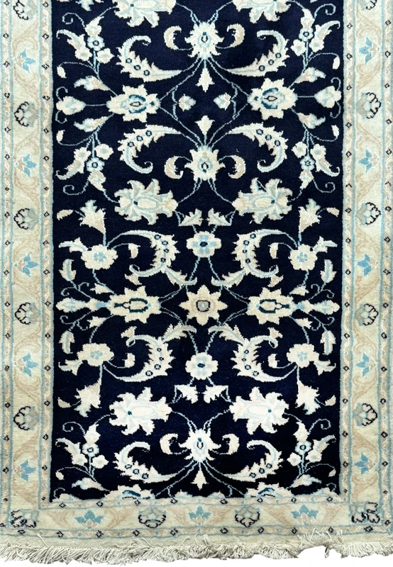 Close-up on the upper portion of the Persian Nain Runner, highlighting the intricate patterns and border design.
