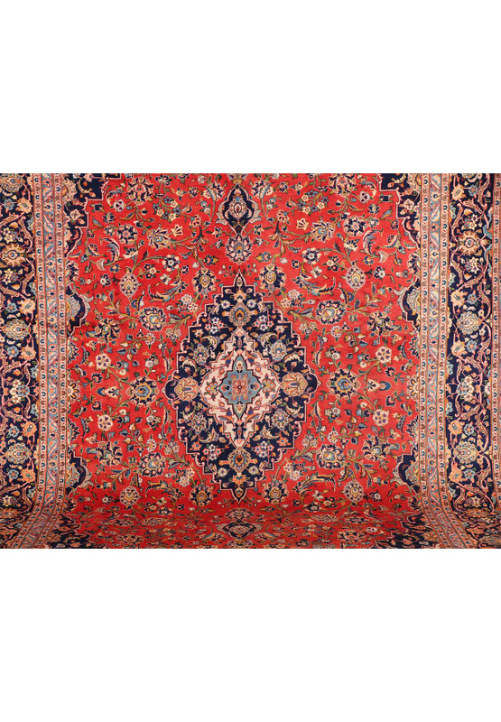 A close-up of the rug's border, illustrating the fine details and color contrast in the patterns that edge the rug.