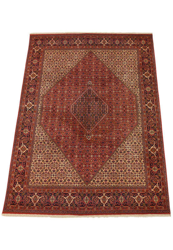 An expansive view of the Persian Bijar Iron Rug spread on the floor, illustrating the precise symmetry of the central diamond medallion and the detailed borders that surround it.