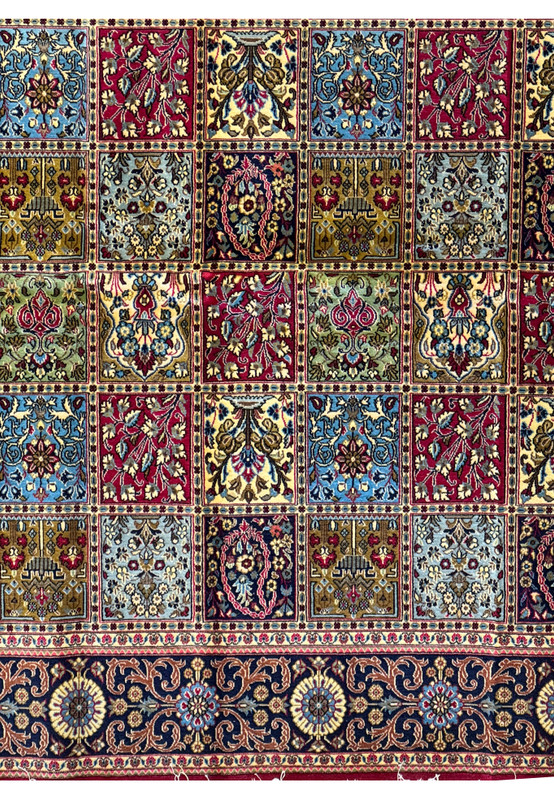 Full-sized image of a Persian Qum Kork rug laid out to display its extensive pattern work and the diverse color palette of each panel.