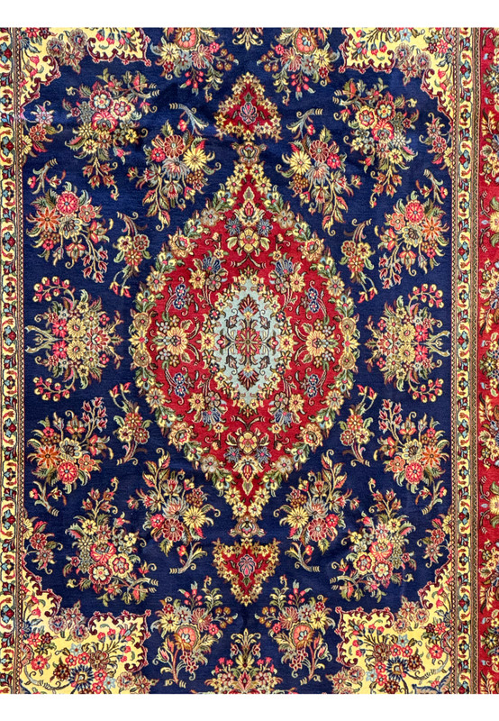 Zoomed-in detail showcasing the fine weaving and vibrant color details of the Persian Qum Kork rug, with close-ups on the detailed floral motifs and delicate pattern
