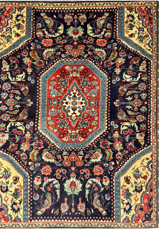 Close-up of the central medallion on the Persian Bidjar Rug, featuring intricate botanical motifs and vibrant colors.