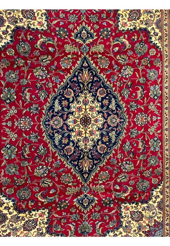 Detailed view of the Persian Qum Kork Rug's central medallion, emphasizing the elaborate design and color contrasts.