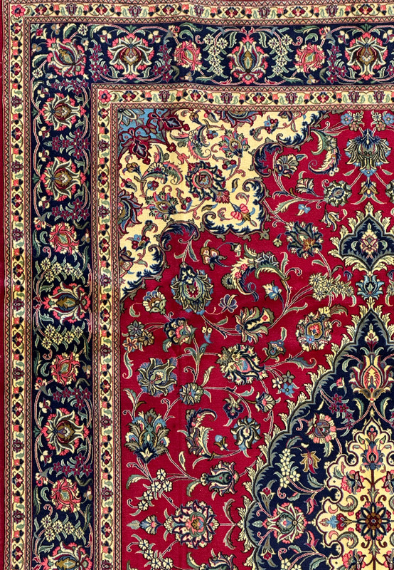 Detailed view of the intricate floral border of the Persian Qum Kork Rug, highlighting the use of multiple colors and fine detailing.