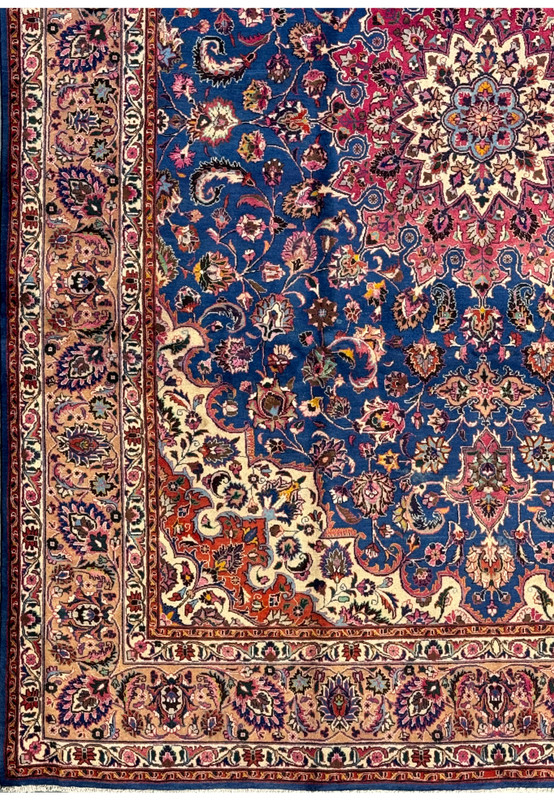 Detailed shot of the border of a 10x13 Persian Mashad Rug, highlighting the repeating floral patterns and guard borders