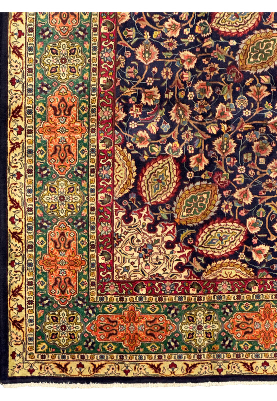 A close-up of the Persian Tabriz Rug rolled partially to show both the front and back. This view highlights the dense knotting and fine workmanship, as well as the vibrant colors and detailed patterns on the front. The back of the rug reveals the structure and quality of the weave, emphasizing its handmade nature and durability.