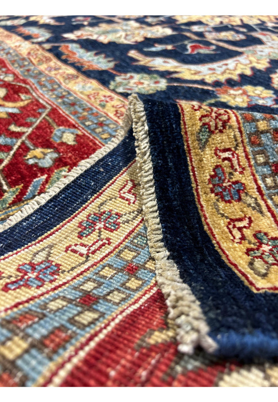 Close-up of the edge of a Ziegler rug, showing the high-quality weave and detailed border patterns.