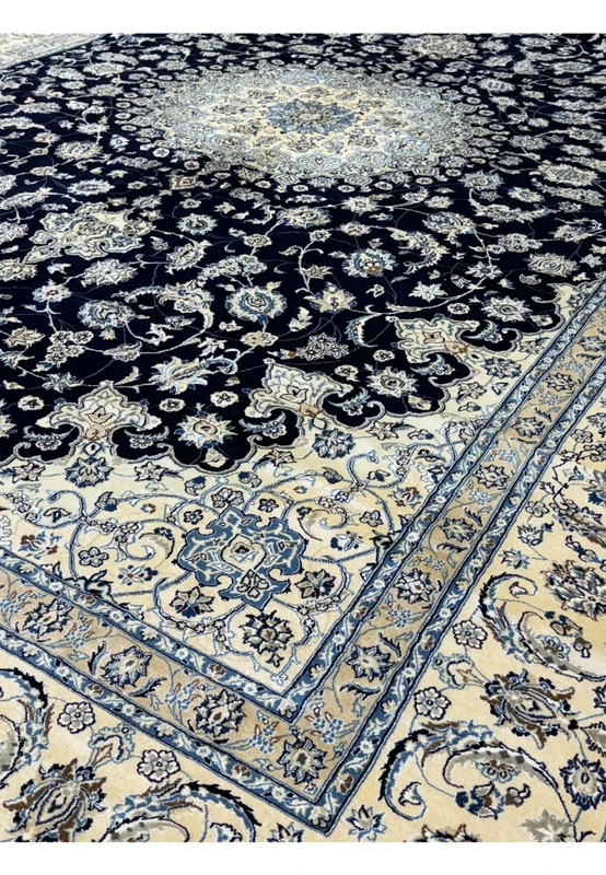 Side view of the 13'2 x 19'4 Nain Persian rug showing intricate patterns