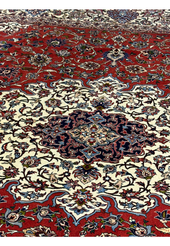 Close-up view of central medallion and intricate floral motifs in Persian Isfahan Silk Rug.