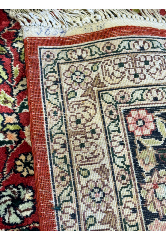 backside of 5x8 Kashmiri Oriental Rug highlighting the dense weave technique.