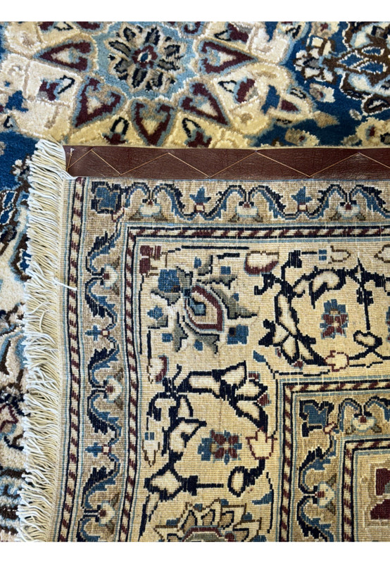 Backside view of this 6'5x6'5 Nain Persian Rug showcasing its authentic handmade high quality weave.