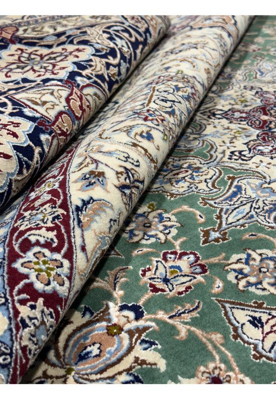 Rolled-up view showing the thickness and quality of the 9 x 9 Nain 6LA Persian Rug.