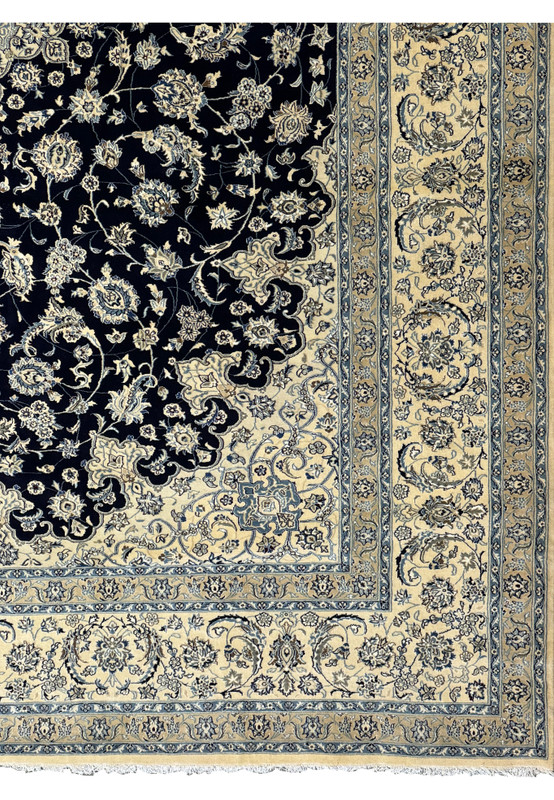 Close-up of the fringe and corner details on the 13 x 19'8 Persian Nain Rug