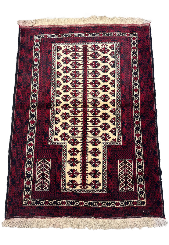 Vertical view of a 3'1 x 4'2 Persian Baluch prayer rug with deep red, blue, and ivory colors, featuring symmetrical star motifs and traditional borders