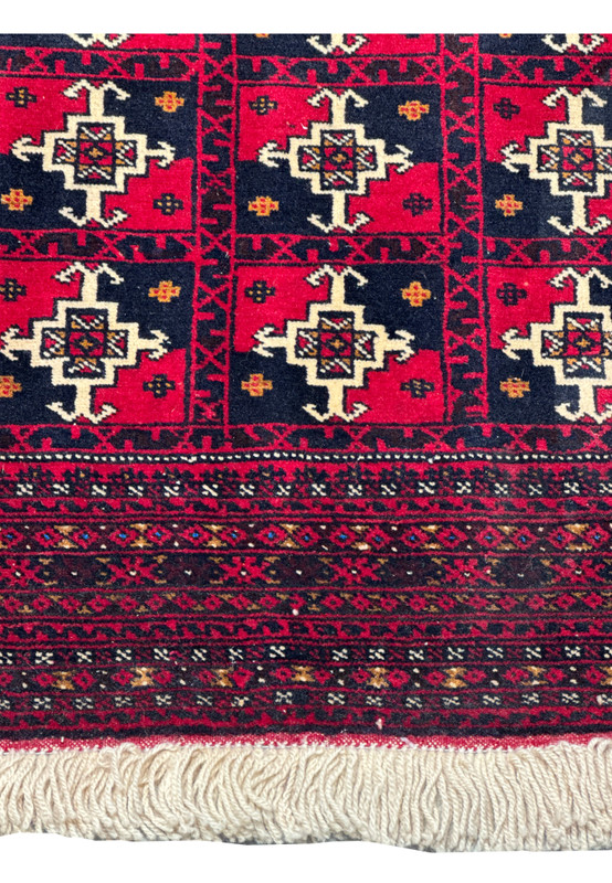 Bottom section of 3'6 x 4'9 Persian Baluch Rug with fringe detail.