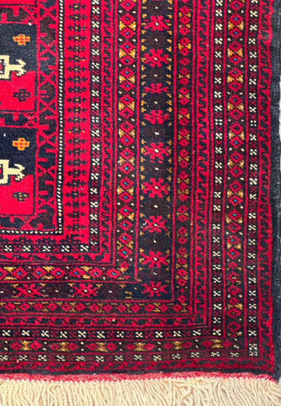 Detailed corner view of 3'6 x 4'9 Persian Baluch Rug highlighting border patterns.