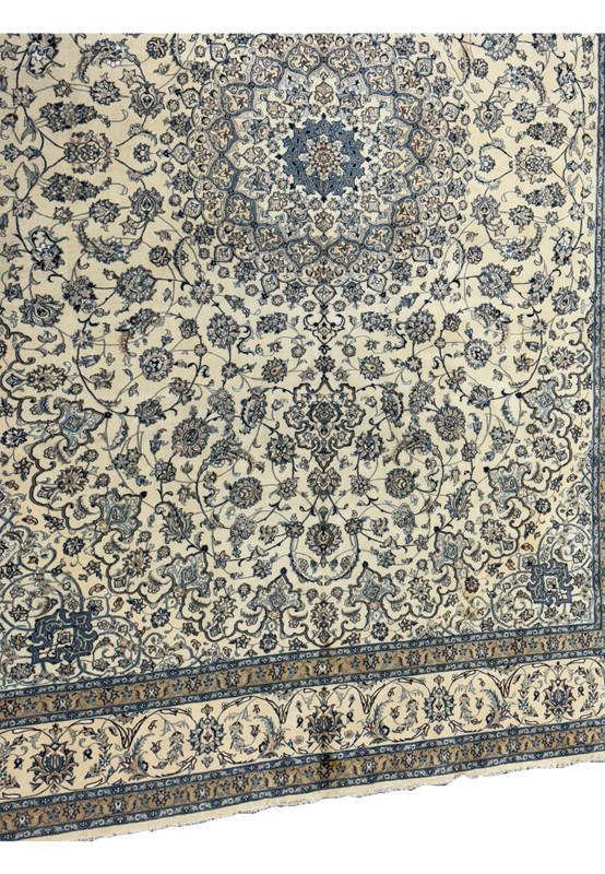 Symmetrical floral and vine motifs on a 13 x 19'6 Persian Nain 9LA Wool & Silk Rug